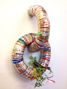 Quetzal Sittin' on da Rainbow Chain,  recycled aluminum, vhs tape, pvc greenery, 24"x15"x5". Da Rainbow Chain     is chain is made from the  ends of the      recycled aluminum cans. 