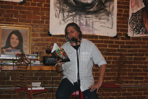 Author and event organizer Dr. Tim Gilmore reads excerpts from his books “In Search of Eartha White, Storehouse for People” and “Stalking Ottis Toole, A Southern Gothic” at the Silver Cow.