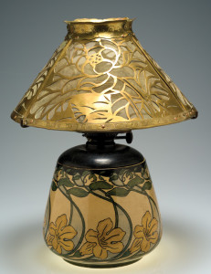  Lamp with shade, c.1902. Ceramic base—painted underglaze of “cat’s claw vine” design. Esther Huger Elliot, decorator; Joseph Meyer, potter. Cut out brass shade with copper screen in magnolia design. Artist unknown. Newcomb Art Collection, Tulane University, New Orleans, LA.