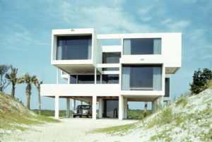 William Morgan. This beachfront house is composed of four masonry towers that elevate the horizontal living spaces above the existing dune. The plan is elegantly simple, yet layered to accommodate the varied spaces needed for a large family. It is recognized as one of the “Top 100 Buildings & Places in Florida.”